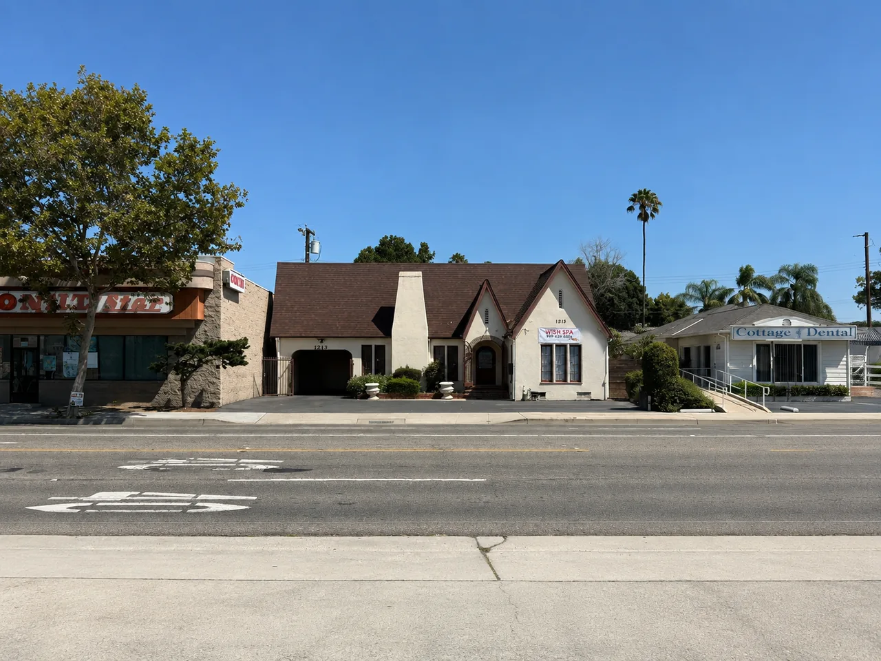 The Wish Spa & Massage cottage seen from the E Chapman Ave sidewalk in Fullerton, CA