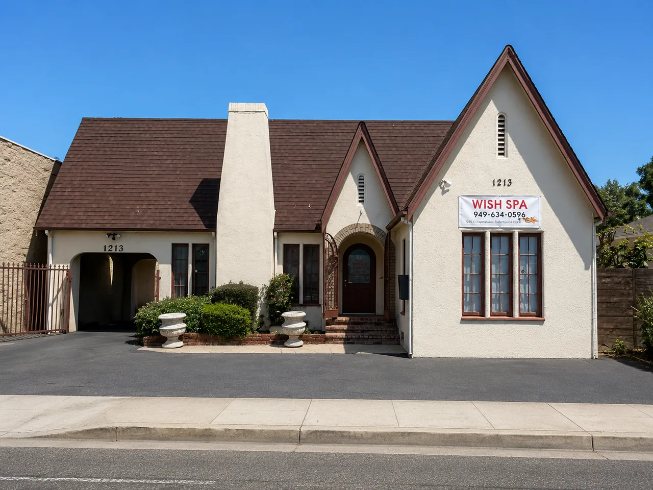 Storefront of Wish Spa & Massage, a white cottage on E Chapman Ave in Fullerton, CA